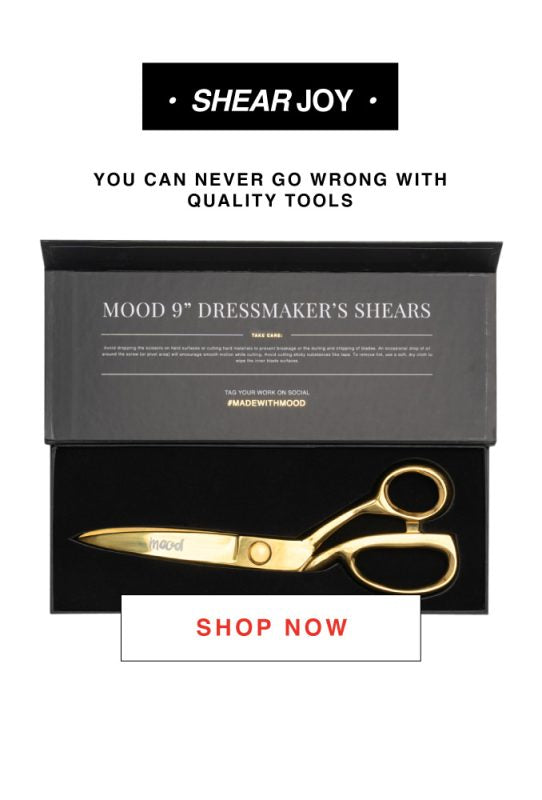 A close up of a pair of scissors in a box