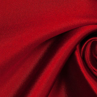 A close up of a red fabric with a very large amount of folds