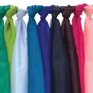a line of many colors of fabric tied and hanging from a bar