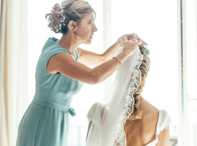 Bride getting ready for her wedding day in a hotel room