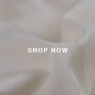 A white background with a white text that says shop now