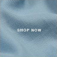 A blue shirt with the words shop now on it