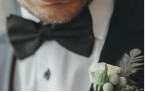A man wearing a tuxedo and a bow tie