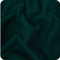 A close up of a green fabric with a black background