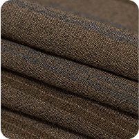 A close up of a pile of brown fabric with a black background