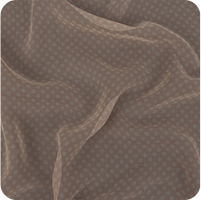 A close up of a brown and white polka dot fabric