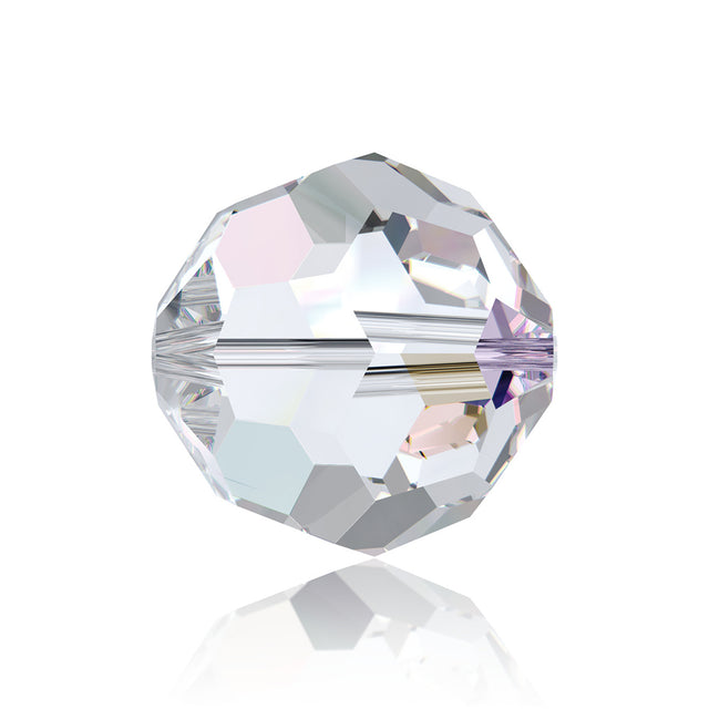 A close up of a crystal bead on a white surface