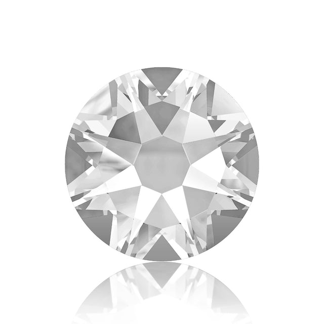 A close up of a diamond with a reflection on a white surface