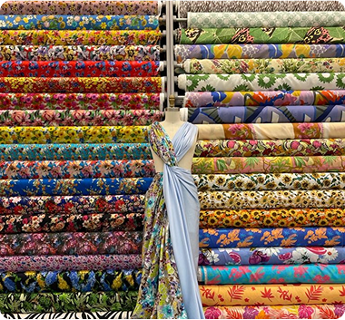 A close up of a display of colorful fabrics in a store