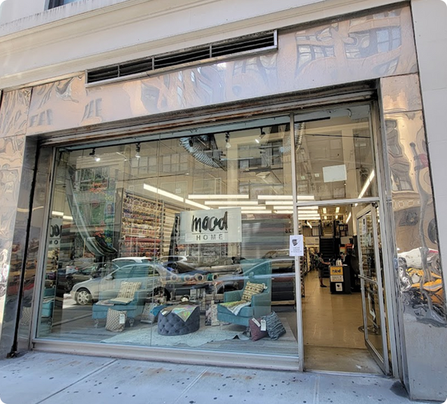 View of a store front with a car in the window