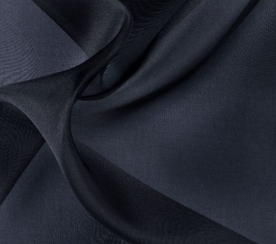 A close up of a black fabric with a very thin design