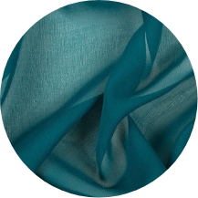 A circular picture of a teal blue fabric with a white background