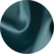 A close up of a blue fabric with a black background